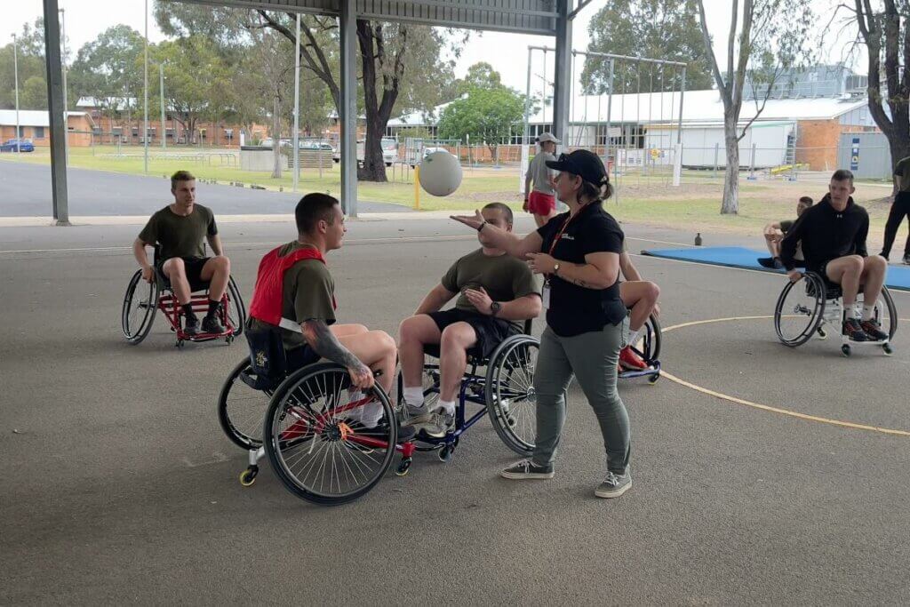 Rachel Kerrigan, one of Invictus Australia's Veteran Engagement Specialists, refs a game of wheelchair rugby at the School of Infantry