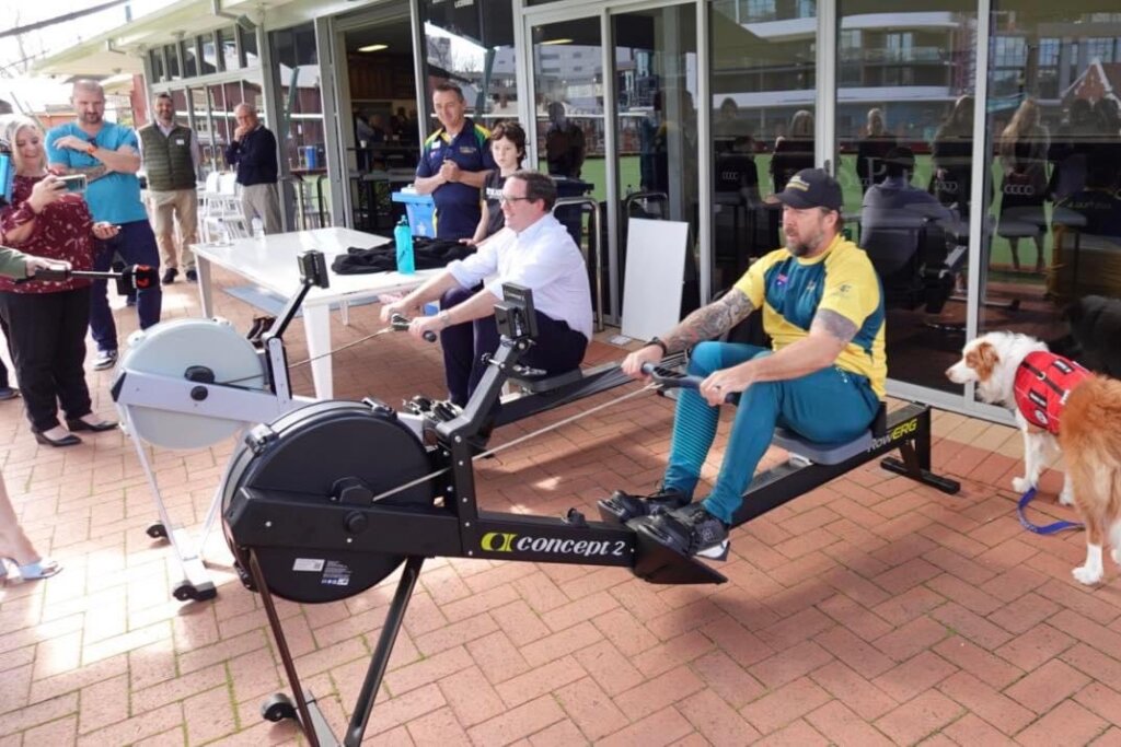 Minister Keogh and Adam Slot competing in the Invictus Games sport of Indoor Rowing, at the Invictus Australia WA expansion event