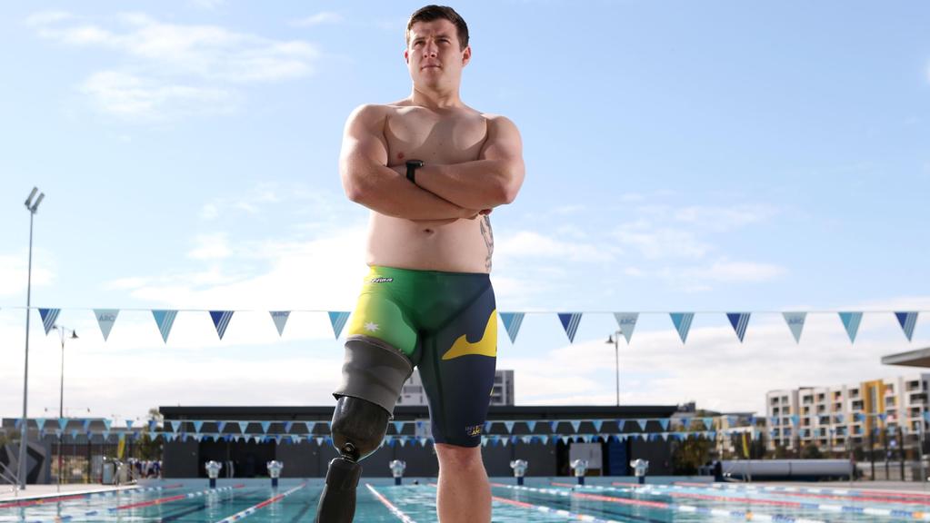 Alumni Mark Daniels posing in front of a swimming pool ahead of the Invictus Games 2018 Sydney