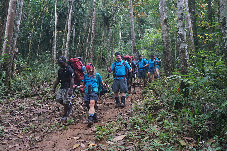 Kokoda trek group on a downhill slope