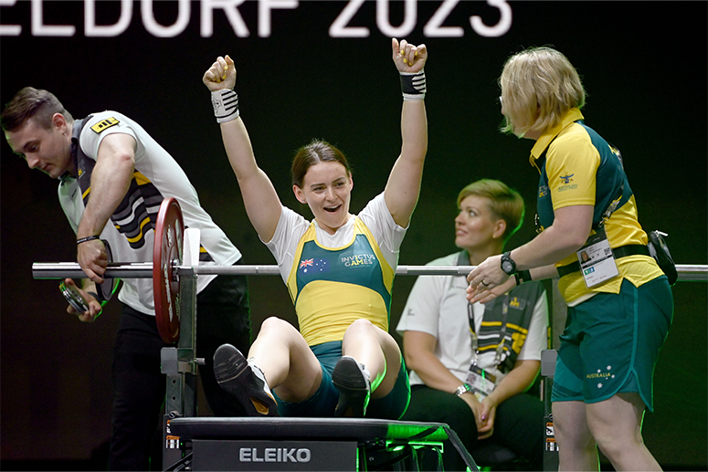 Erin Brigden cheers in Dusseldorf after a successful Invictus Games powerlifting performance