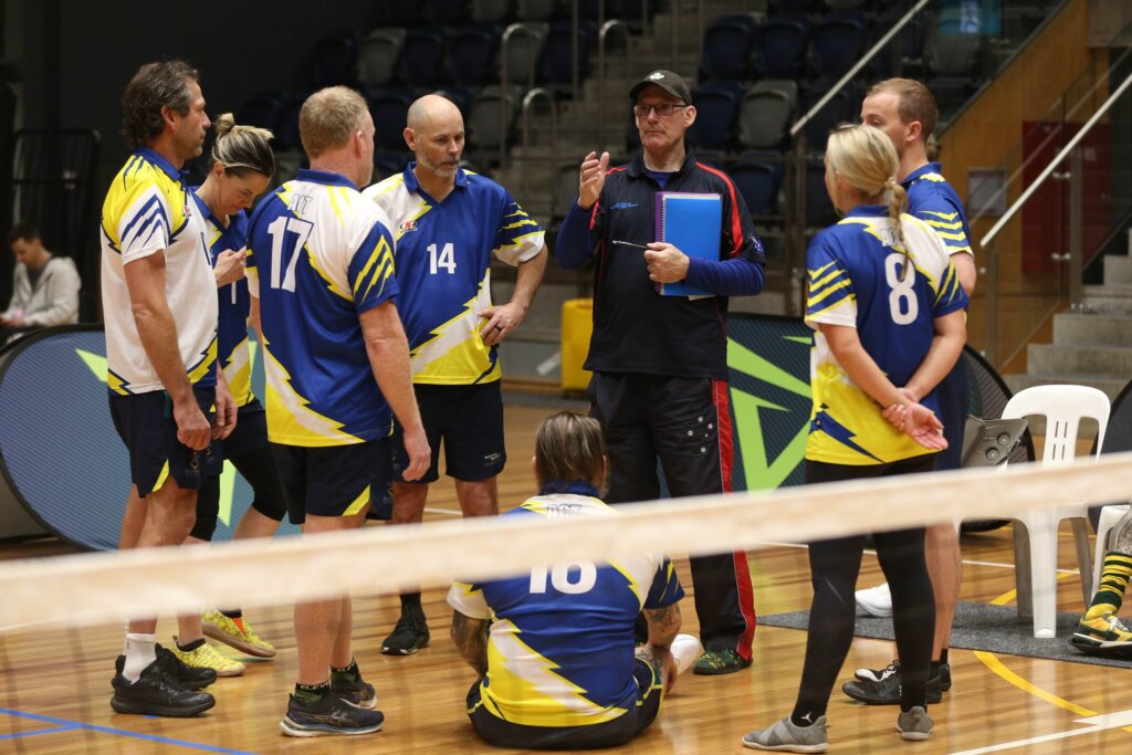 Invictus Games Team Australia train on contingent at the sitting volleyball championships team huddle